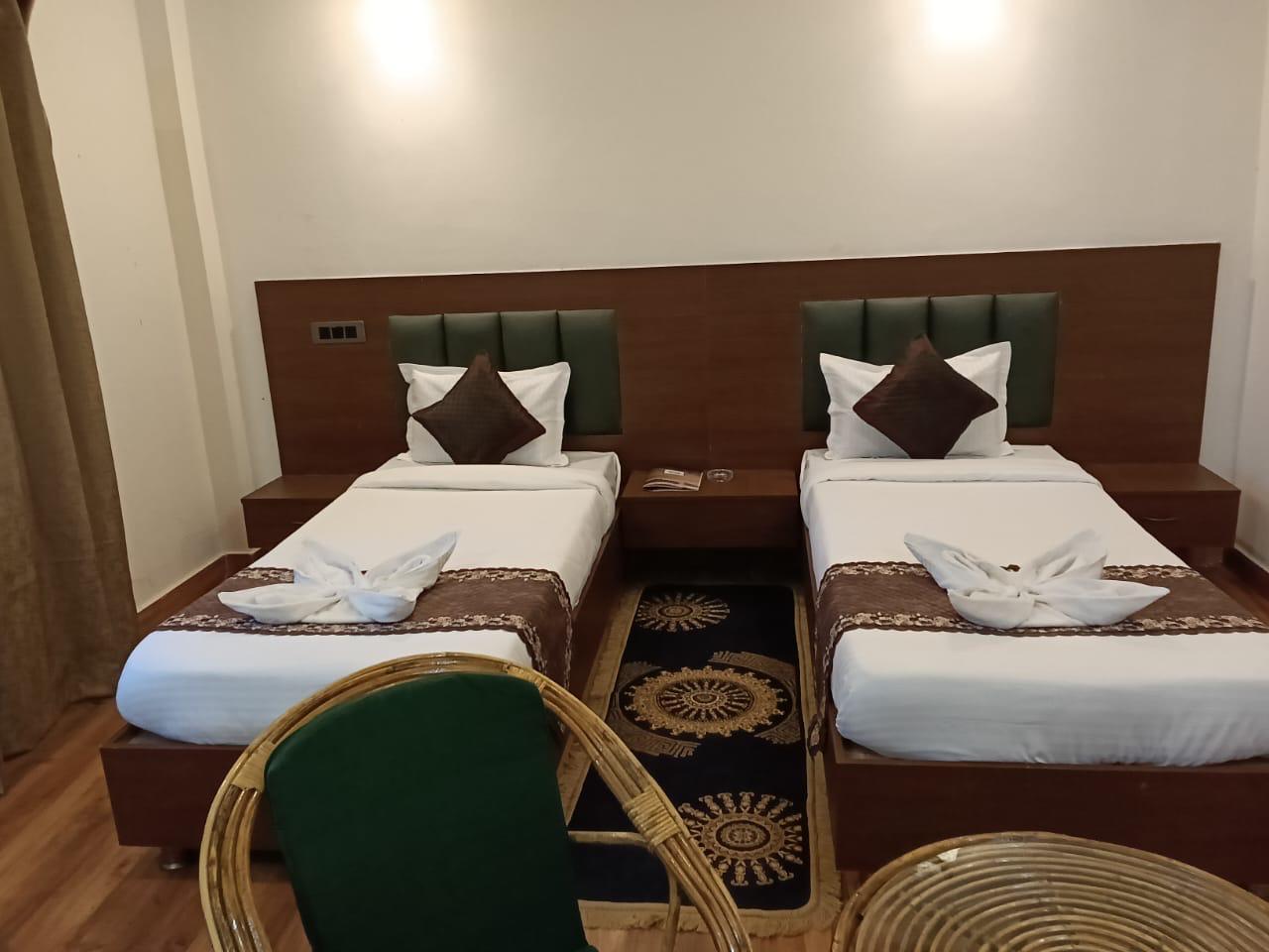 Luxury resort pool with palm trees at sunset